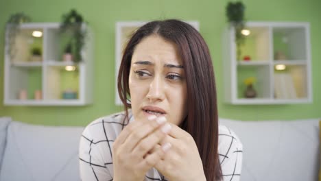 Frustrated-depressed-young-woman-speaks-to-the-camera-about-her-grief.